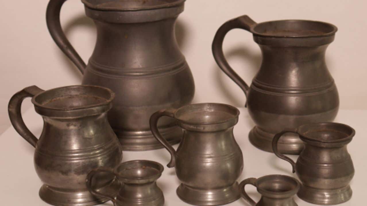 Seven pewter tankards from the museum’s collection.