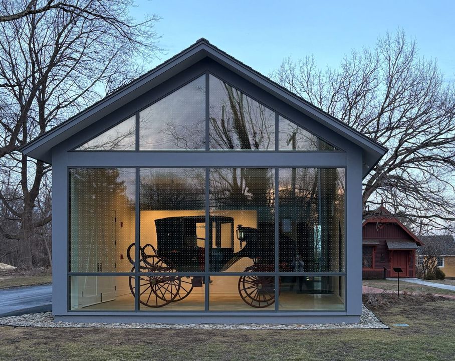 A historic carriage displayed inside the Jim Bach Special Collections Museum.