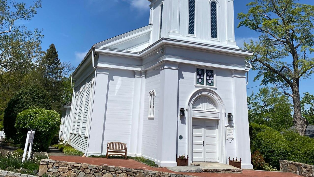 The white steeple and entrance of St. Michael’s Lutheran Church.